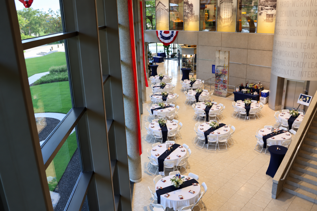 The view of the lobby from the second with tables and chairs set for 120 people