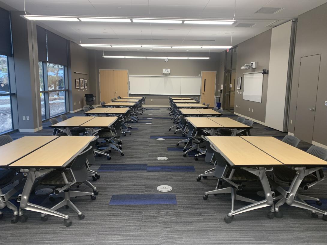 Pods of wooden desks are shown
